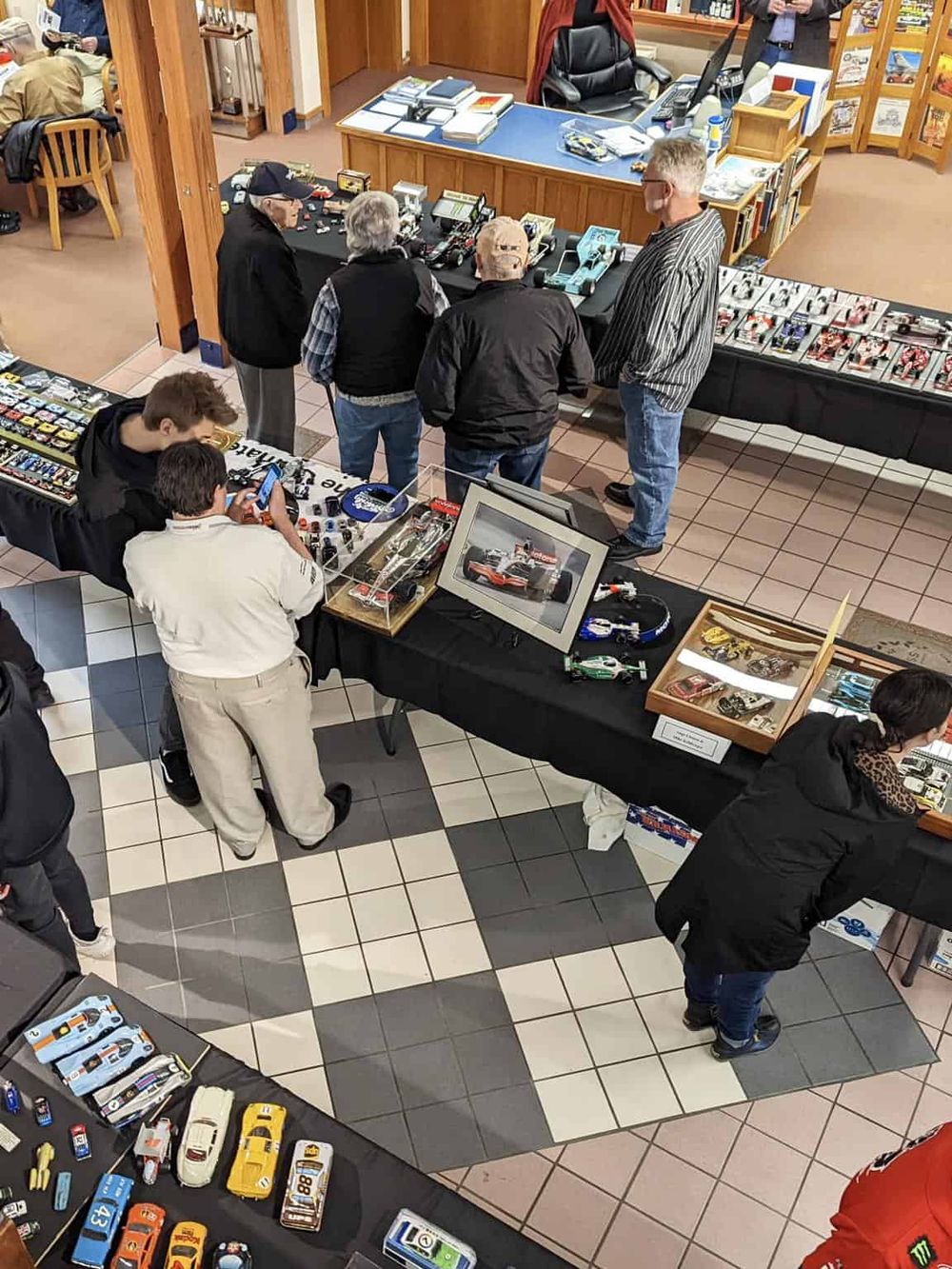 Miniature car collectibles and model cars at a hobby show or store.