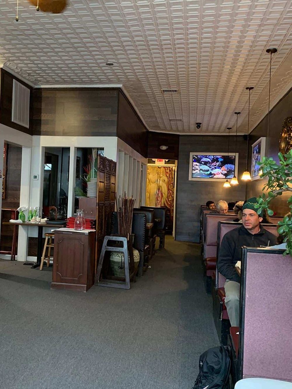 Welcoming restaurant interior with booth seating and ambient lighting for dining relaxation.