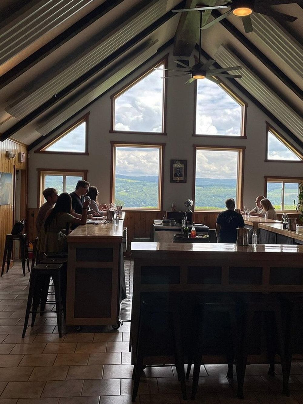 Stunning restaurant interior with large windows and scenic mountain views, perfect for dining at QuestForDirections.