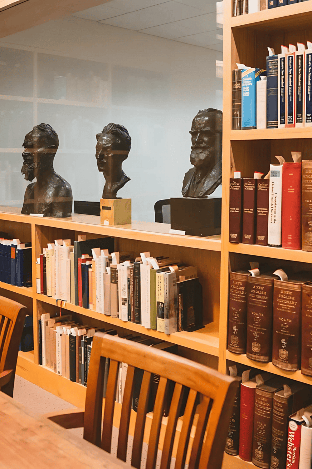 Bust sculptures of philosophers and writers on a bookshelf at QuestForDirections.