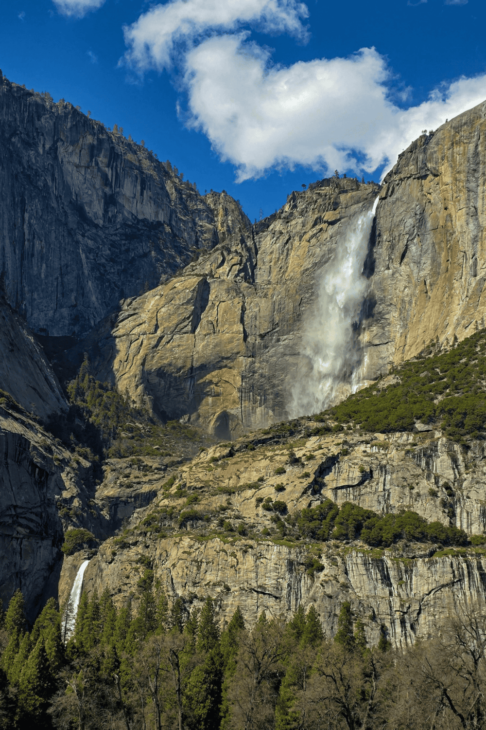 Majestic waterfalls cascading down granite cliffs in Yosemite National Park, California.