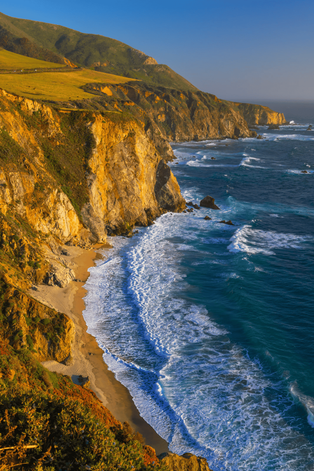 Golden coastal cliffs and scenic ocean views at sunset, California coast, travel, adventure, nature photography.