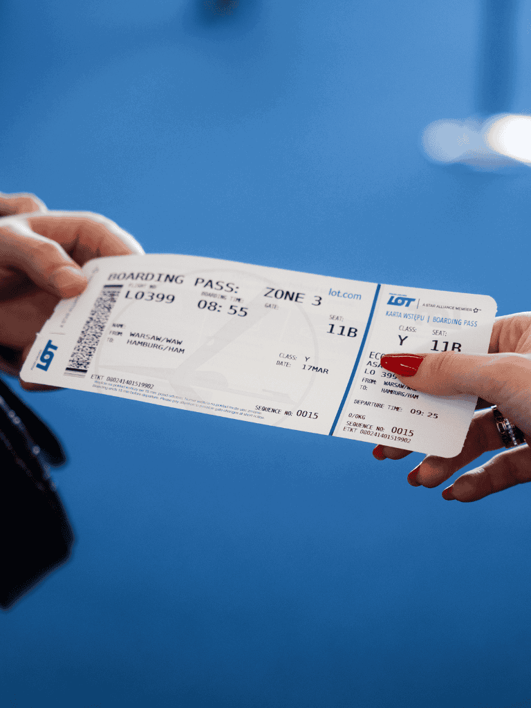 Boarding pass for flight from Warsaw to Hamburg, airline ticket with seat and gate details.