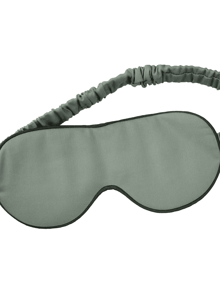 Black sleep eye mask for travel and relaxation.