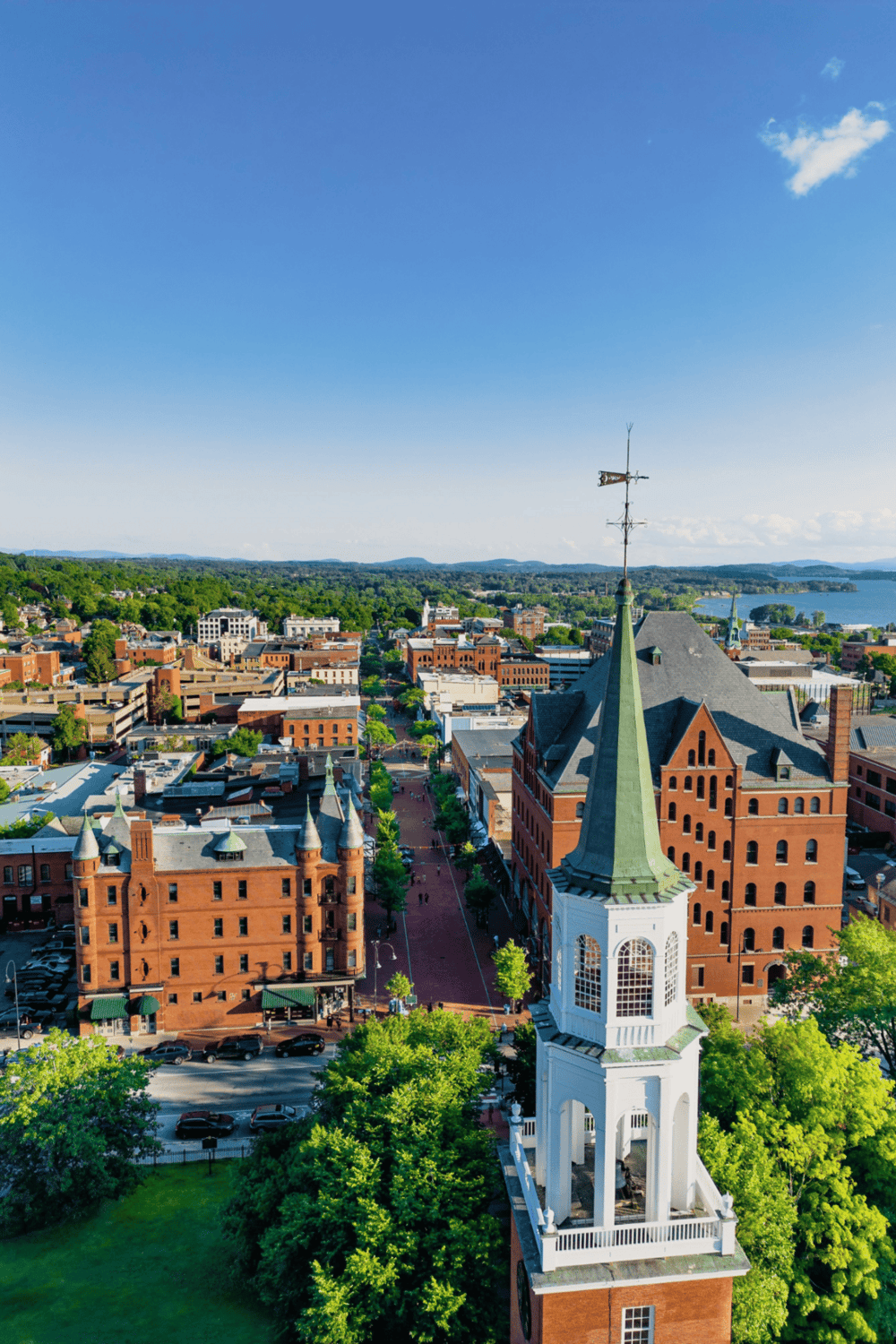 Aerial view of Clarksville TN downtown, historic buildings, courthouse, vibrant streets, river and rolling hills.