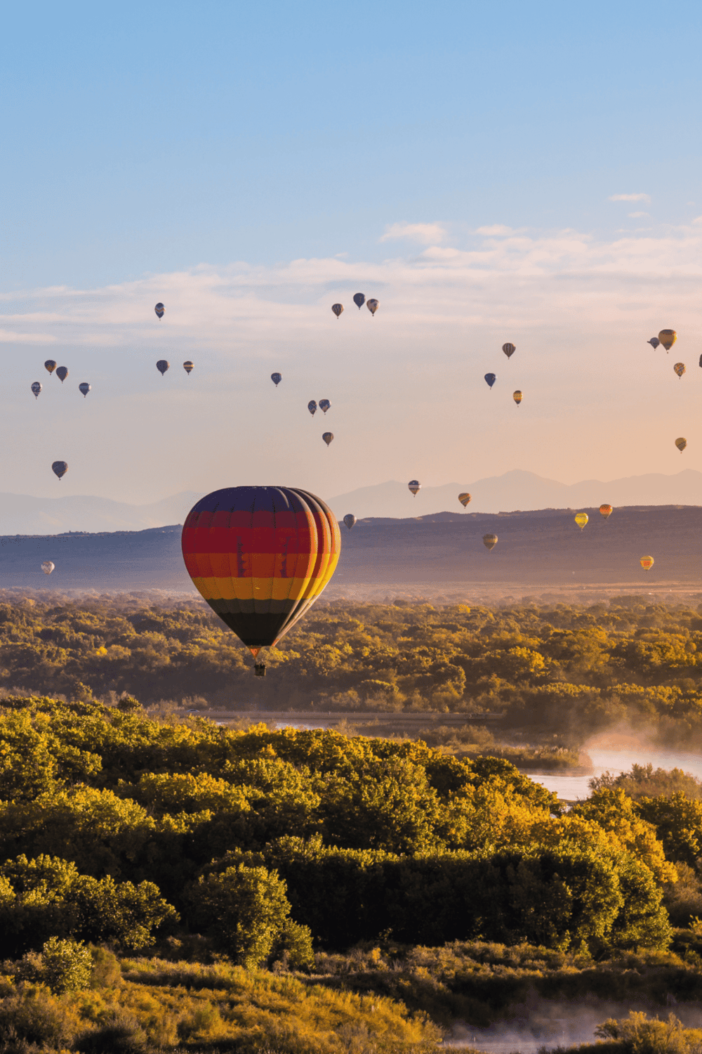 Colorful hot air balloons over scenic landscape at sunrise, adventure travel, flight, tourism, outdoor exploration, QuestForDirections.
