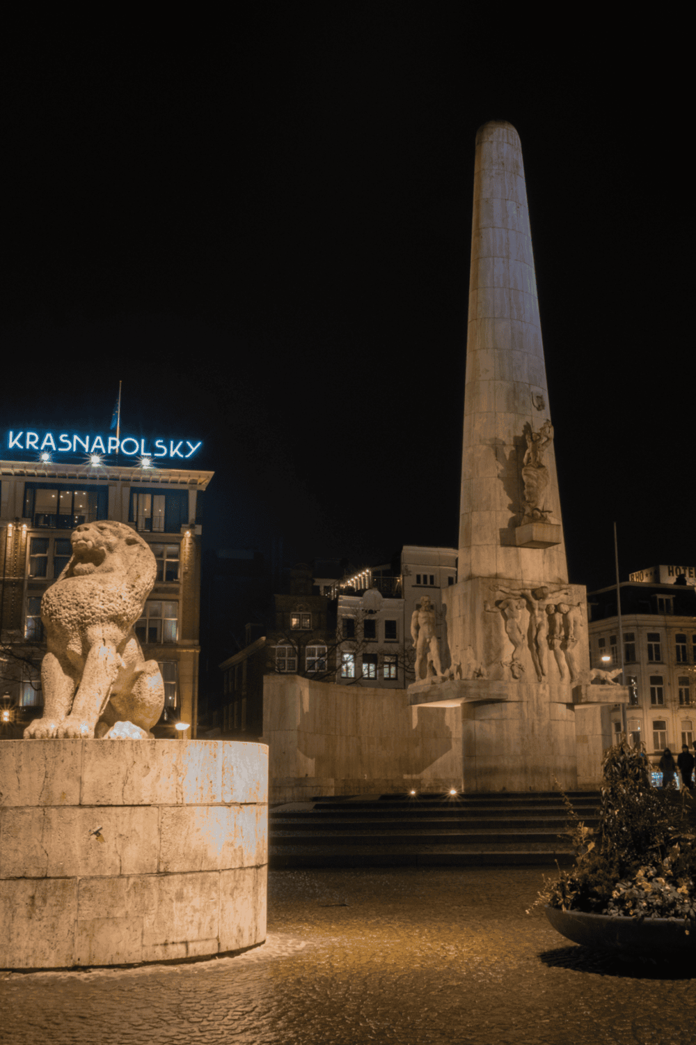 Ancient monument at night in Helsinki, Finland, showcasing historic architecture and modern city lights.