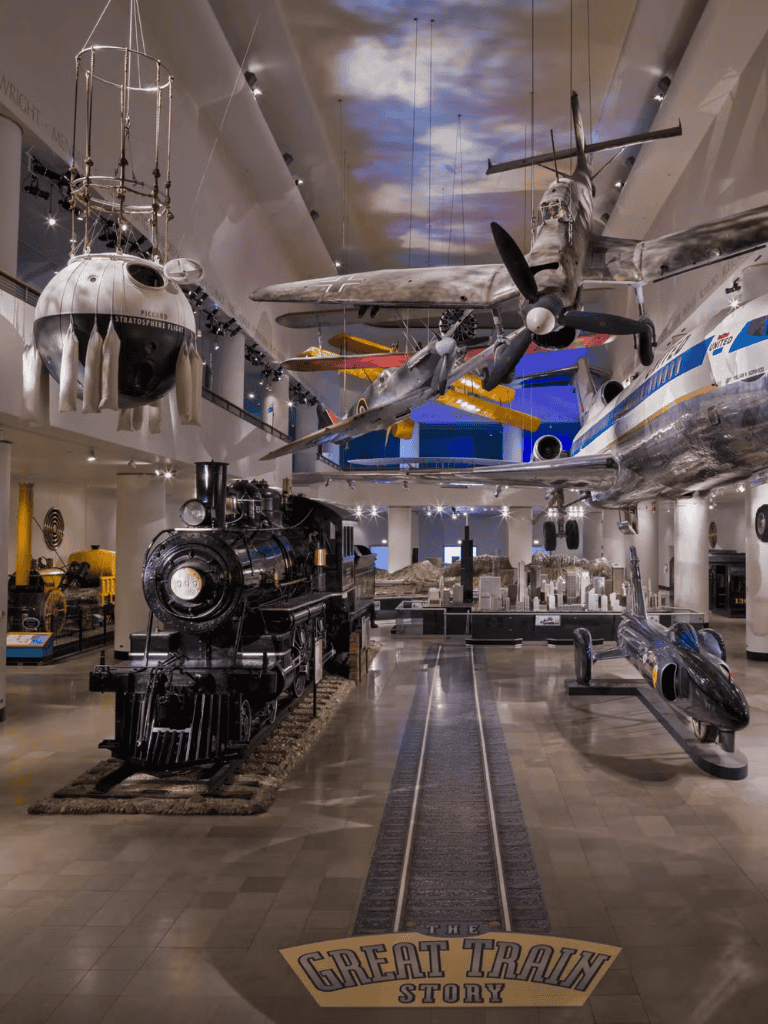 Vintage train museum with aircraft displays and interactive exhibits.