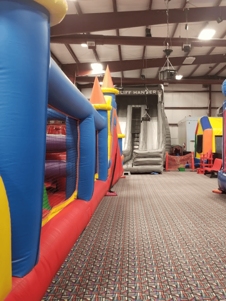 Colorful indoor inflatable playground for kids at QuestForDirections. Fun, safe family entertainment space.