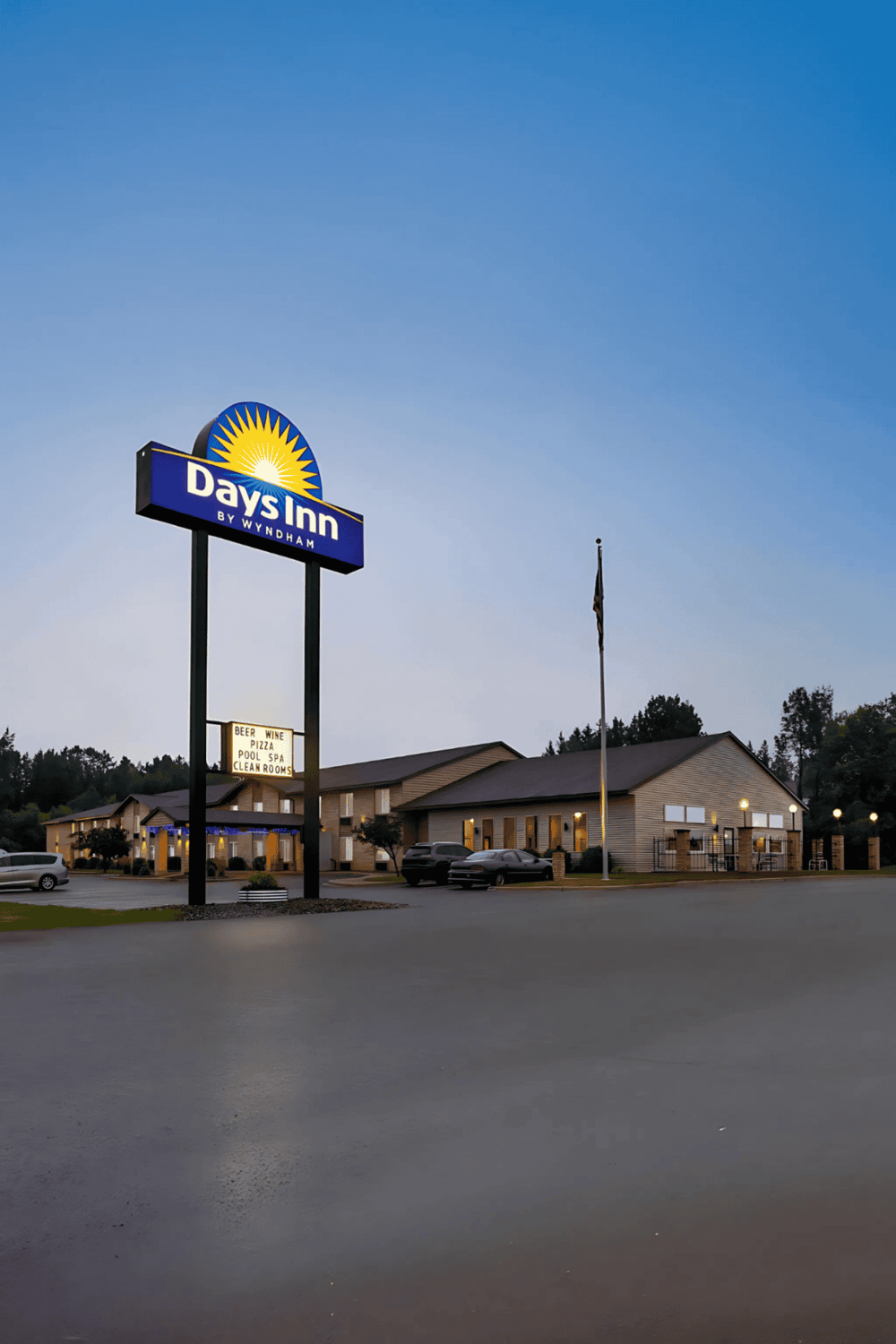1. Bright Days Inn by Wyndham hotel sign at dusk, welcoming travelers.