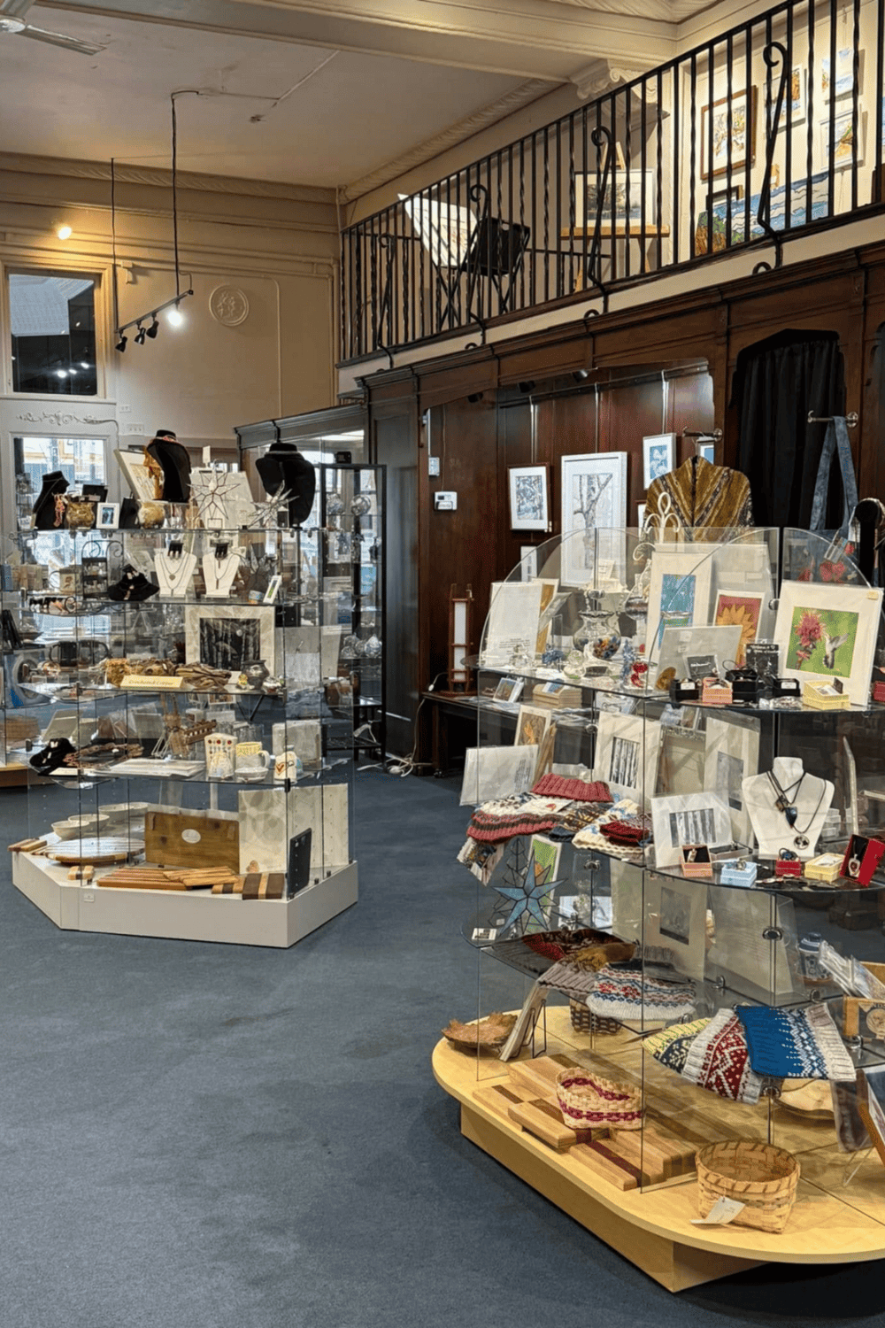 Vintage boutique gift shop displaying jewelry, artwork, and handcrafted items for sale.