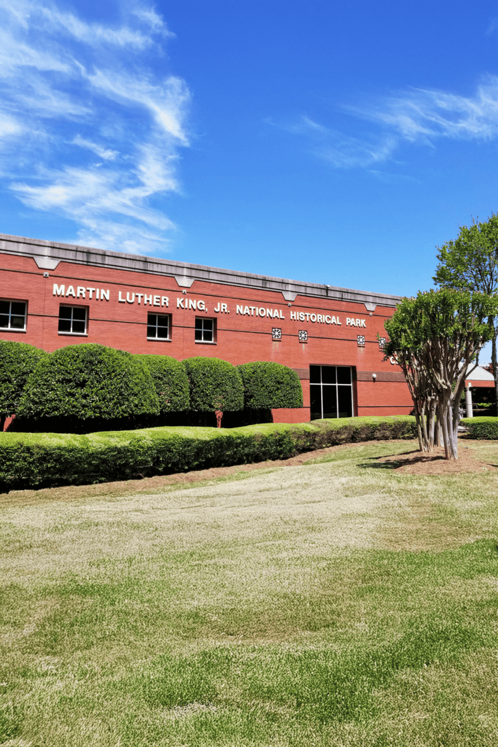 Beautiful scene of Martin Luther King Jr. National Historical Park with clear blue skies and lush greenery.