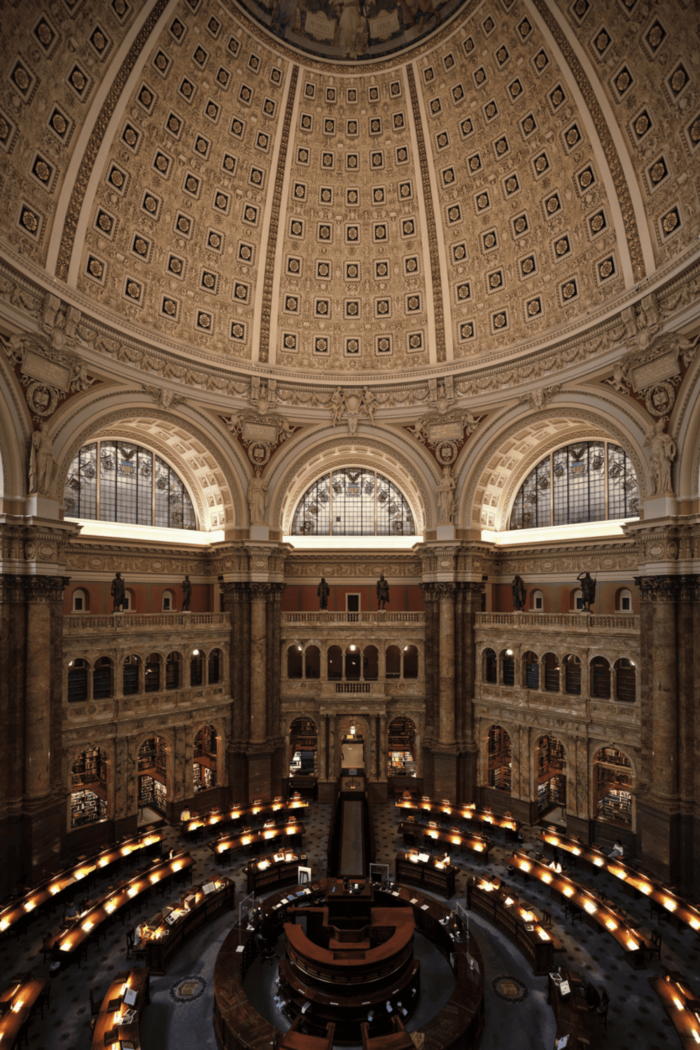 Elegant historic library interior with ornate architecture and grand domed ceiling, a perfect setting for research and reading.