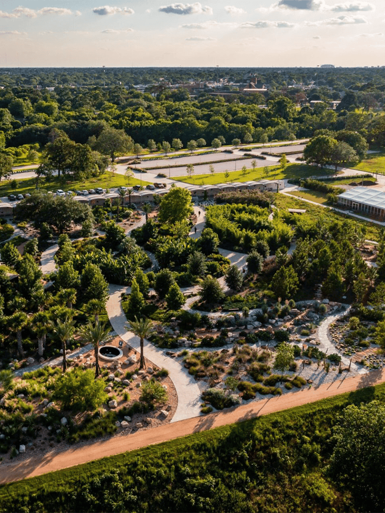 Lush botanical gardens with winding pathways and scenic landscape views.