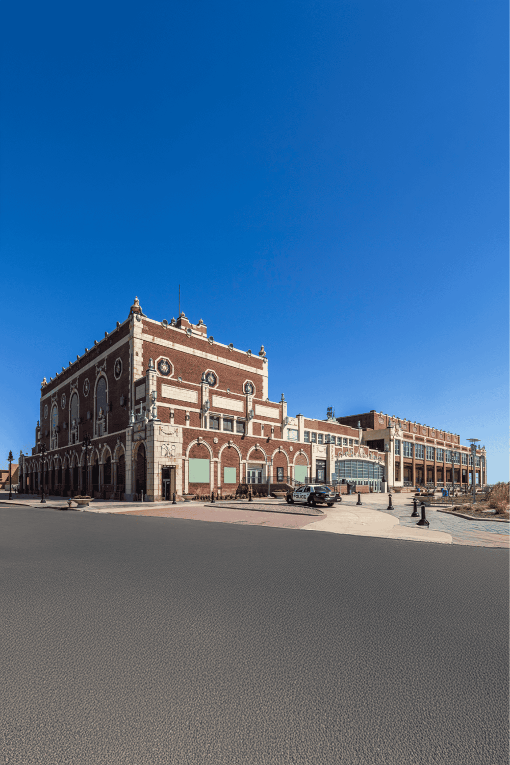 Historic courthouse building with architectural details under clear blue sky.