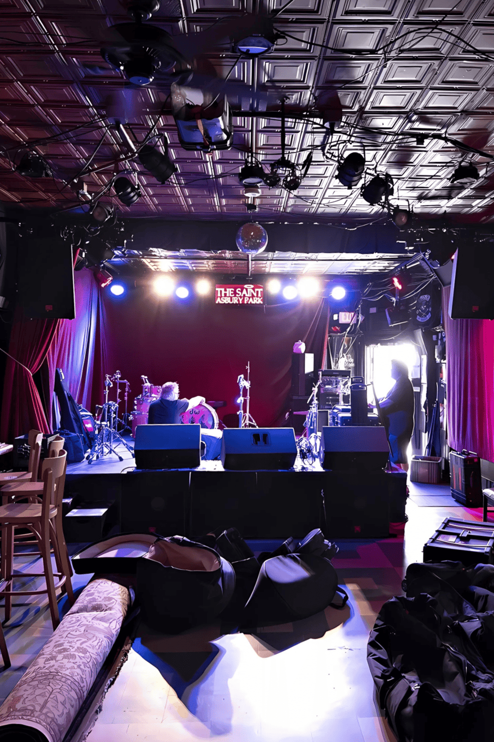 Concert stage at The Saint Asbury Park with lighting and musical instruments.