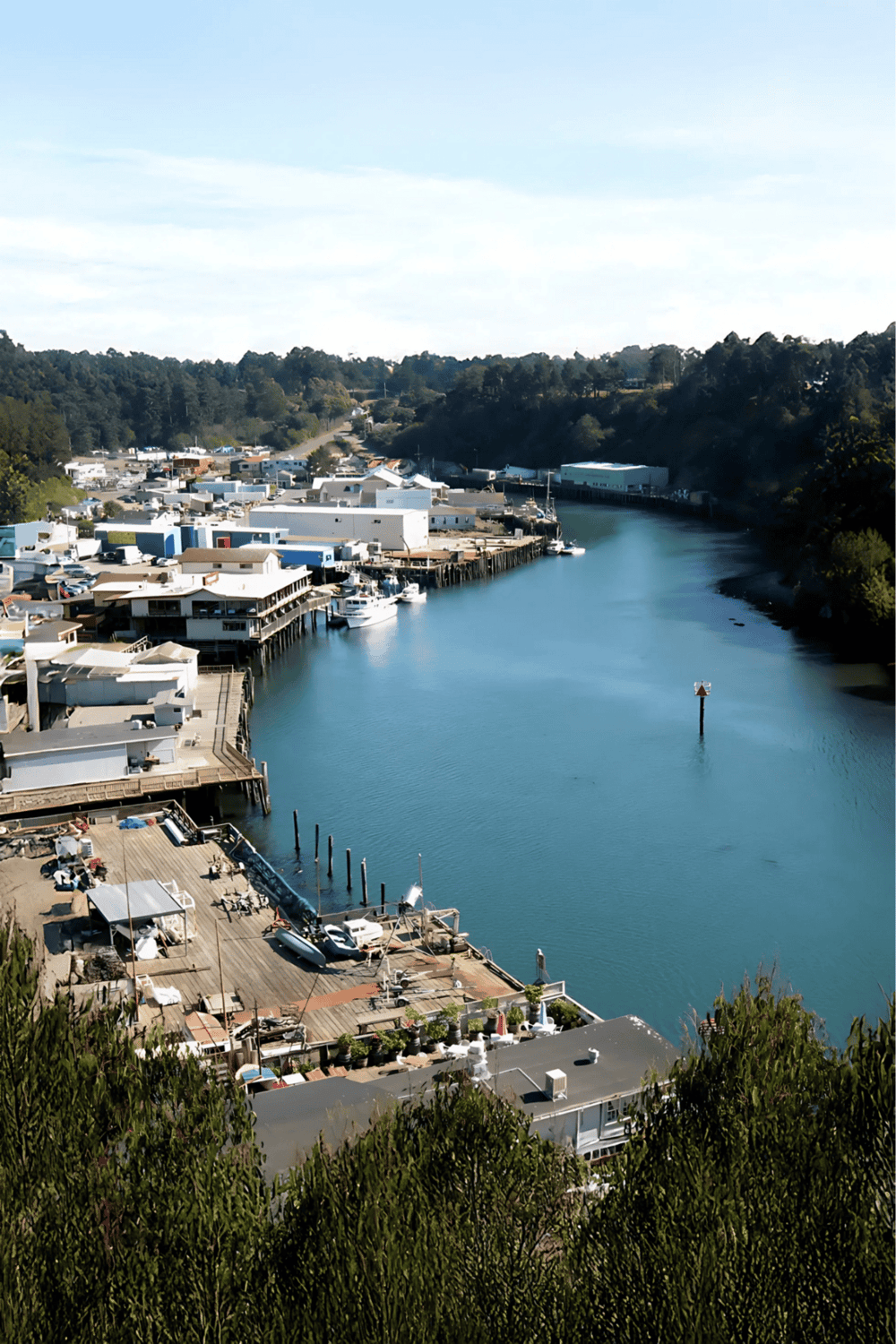 Boating marina along calm waterway in scenic coastal town, popular for water navigation and maritime activities.