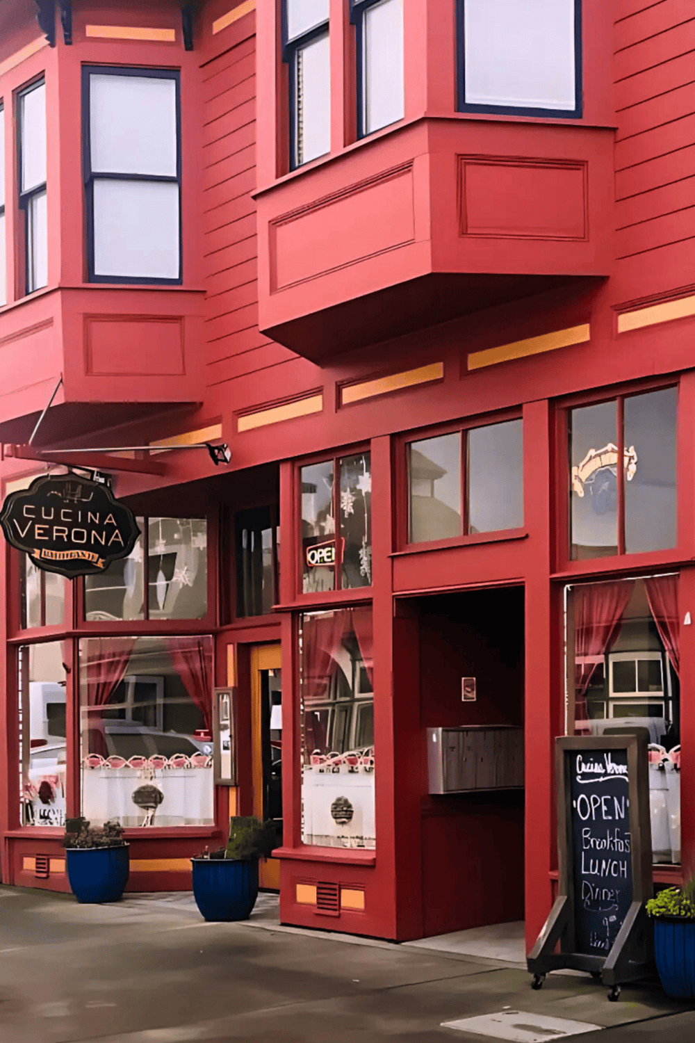 Colorful restaurant facade with large windows and outdoor signage, perfect for dining in downtown area.