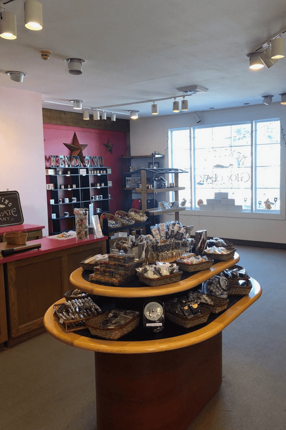 Colorful gift shop with handcrafted items, chocolates, and souvenirs for tourists.