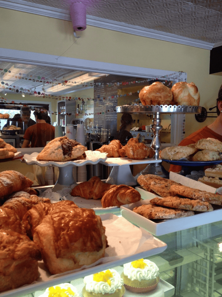 Fresh bakery pastries and desserts at QuestForDirections bakery in a cozy cafe setting.