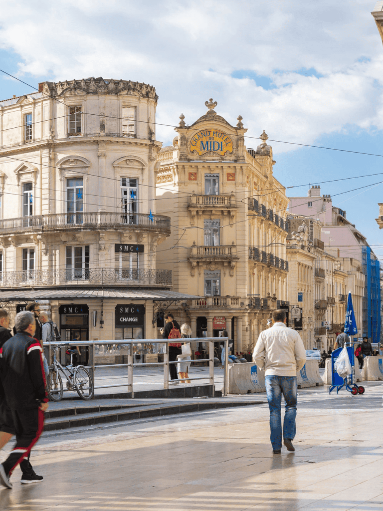 Grand Hotel du MIDI historic building in downtown cityscape.