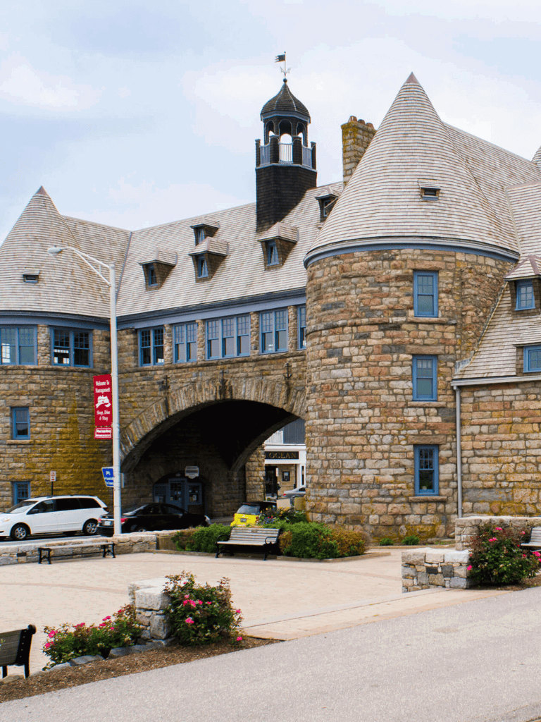 Historic castle-like building with stone walls and turrets, resembling a fairy tale house.