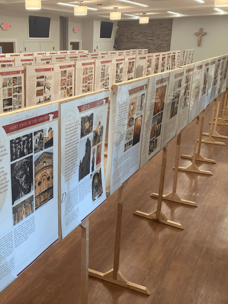 Historical church exhibit with informational display boards on religious art and architecture.