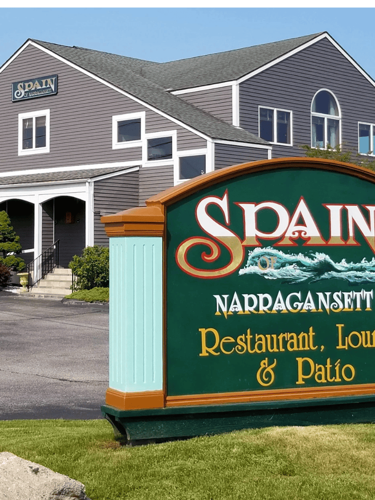 Spain Restaurant and Lounge signage in Narragansett, Rhode Island, with outdoor patio, coastal vibe.