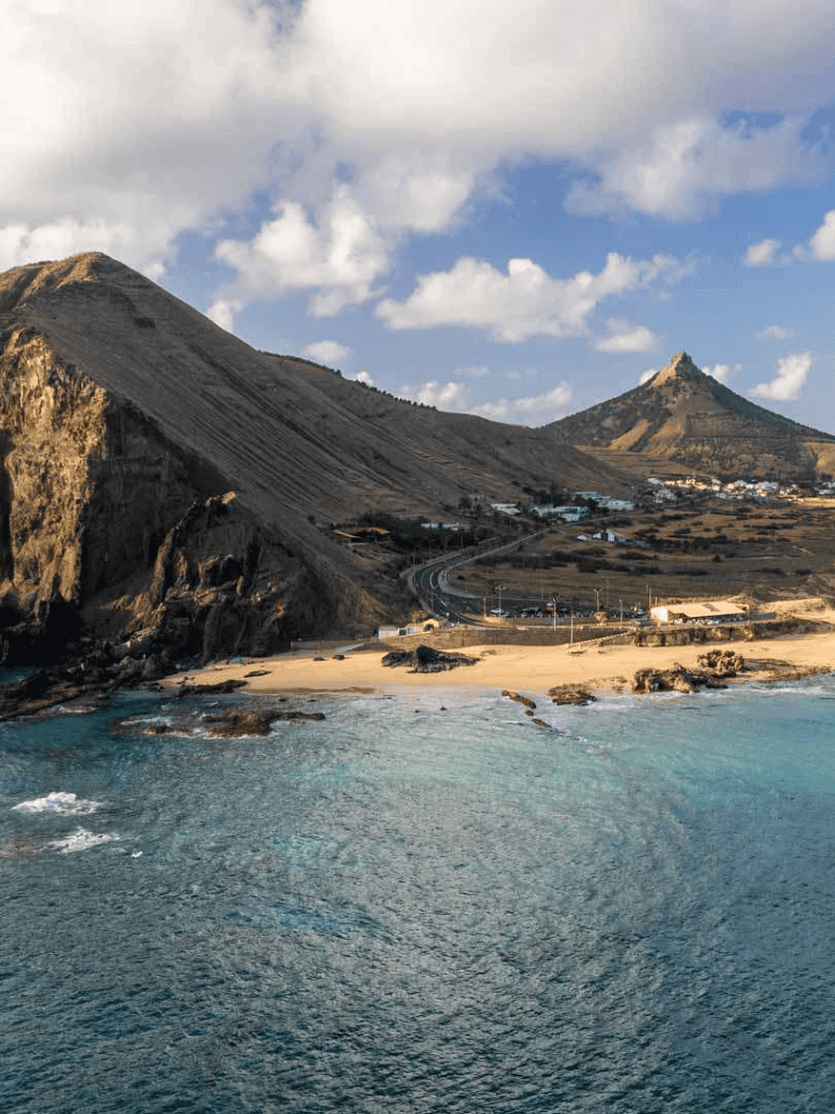 Spectacular coastal landscape with mountains, beach, and ocean views, perfect for travel planning and adventure.