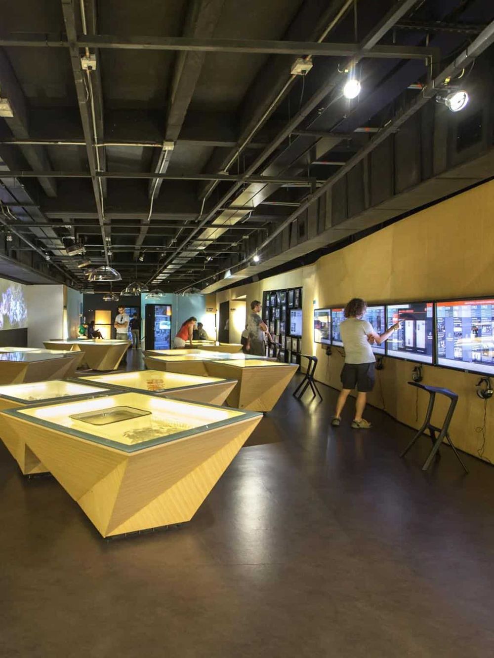 Interactive museum exhibits with digital screens for learning and exploration.