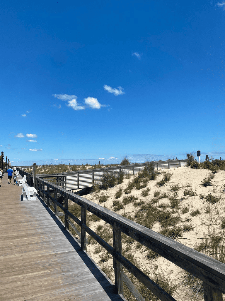 Relaxing beach boardwalk with sand dunes and ocean views, perfect for scenic coastal walks and outdoor activities.