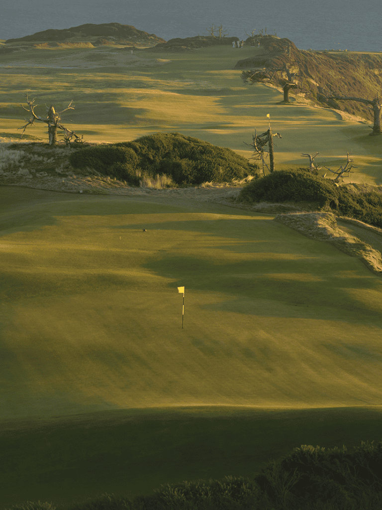 Breathtaking golf course landscape with rolling greens and coastal views.