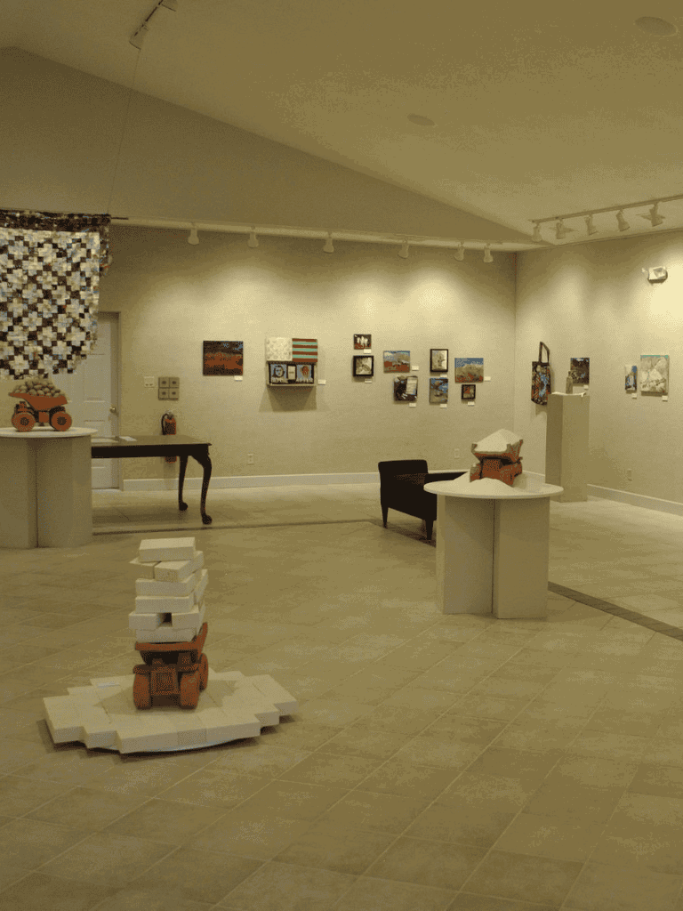 Stacked foam blocks art installation in an art gallery.