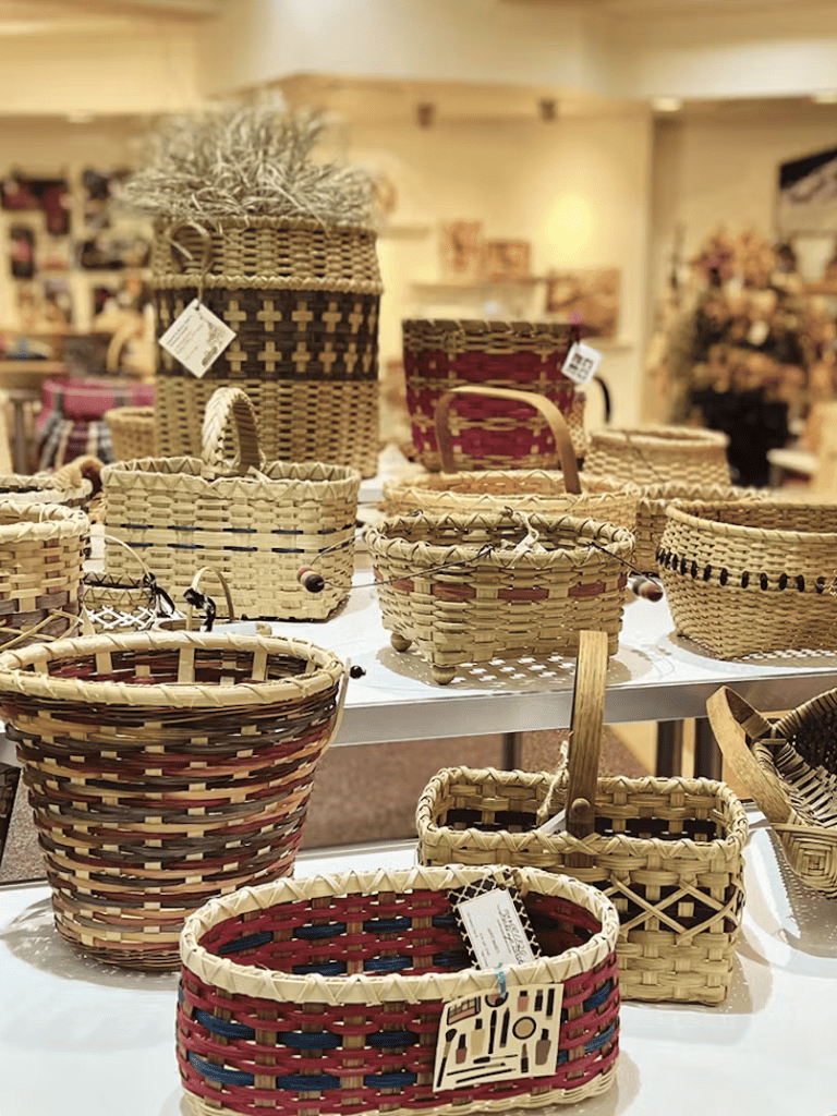 Colorful handmade woven baskets on display at QuestForDirections home decor store.