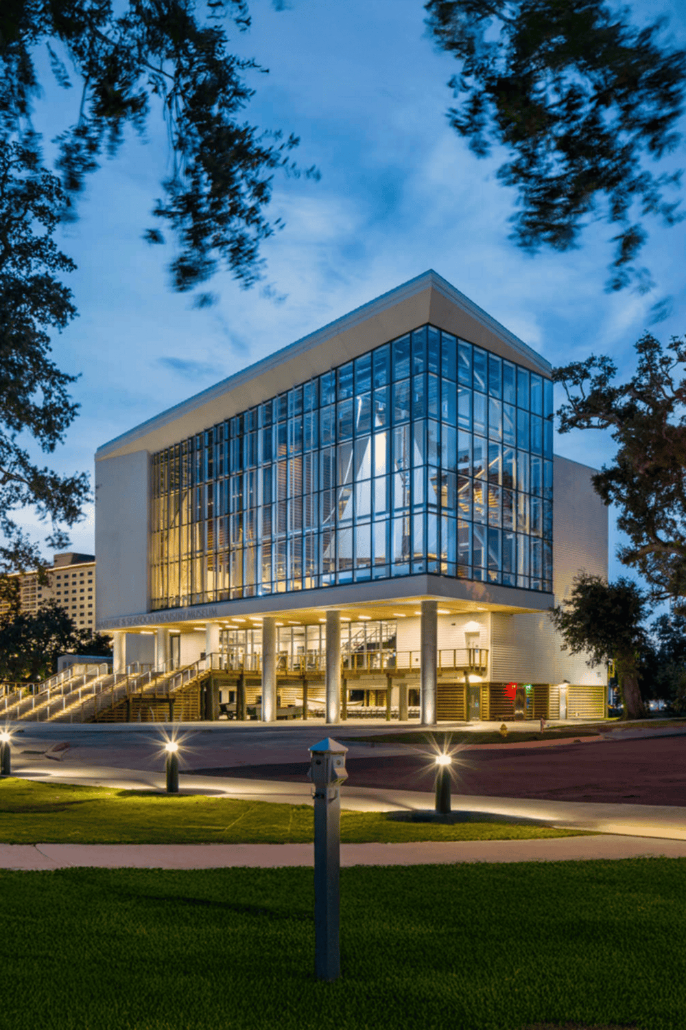 Innovative modern museum building with glass facade, showcasing architecture and design excellence.