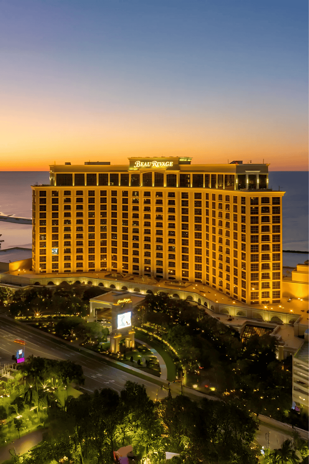 Luxury beachfront hotel at sunset, Beau Rivage casino resort in Biloxi, Mississippi.
