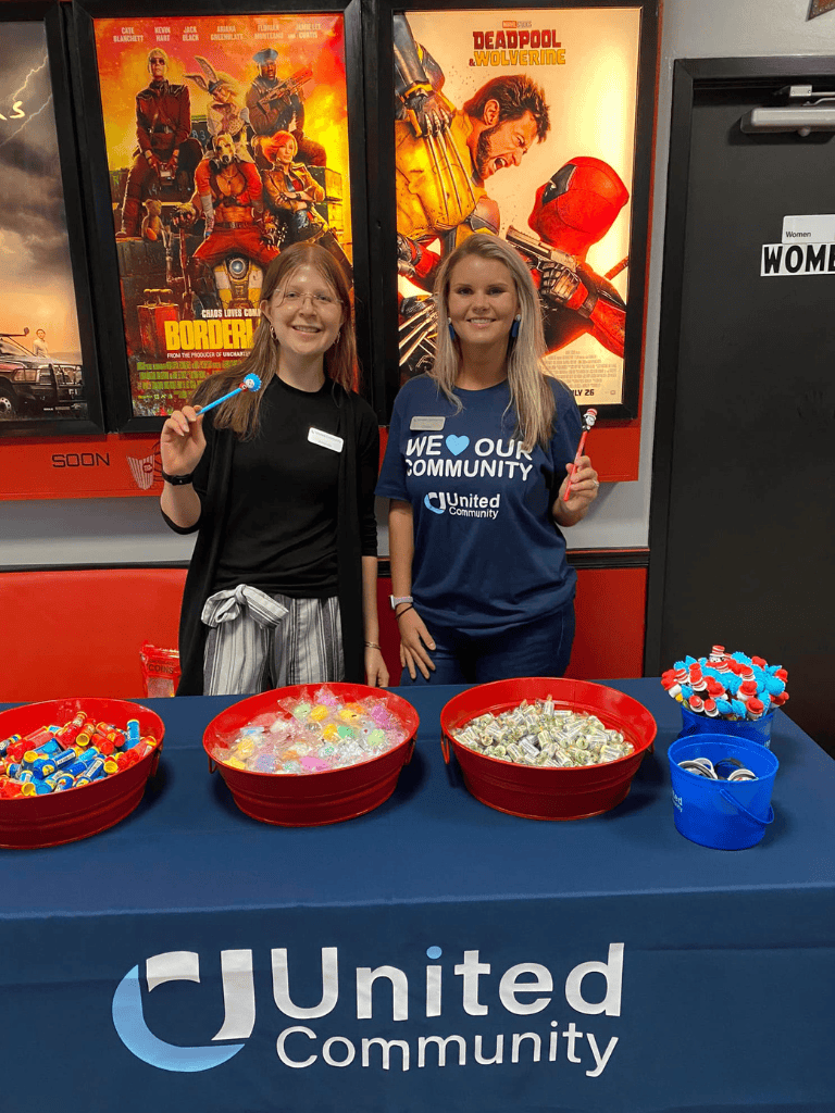 Loyal volunteers at United Community event promoting local engagement and charitable activities.