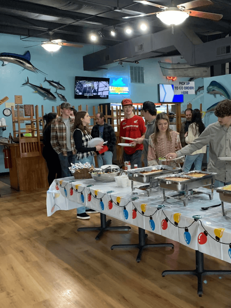 Fresh seafood buffet at QuestForDirections with guests enjoying variety of dishes in a marine-themed restaurant.