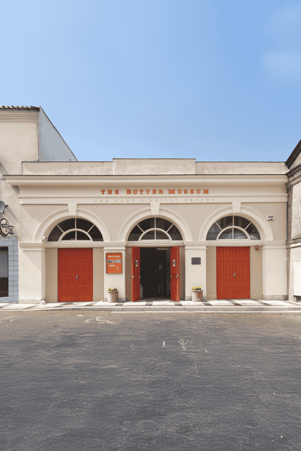 Vintage The Butter Museum building with red doors, located in a historic area, showcasing Irish culinary history and butter making heritage.