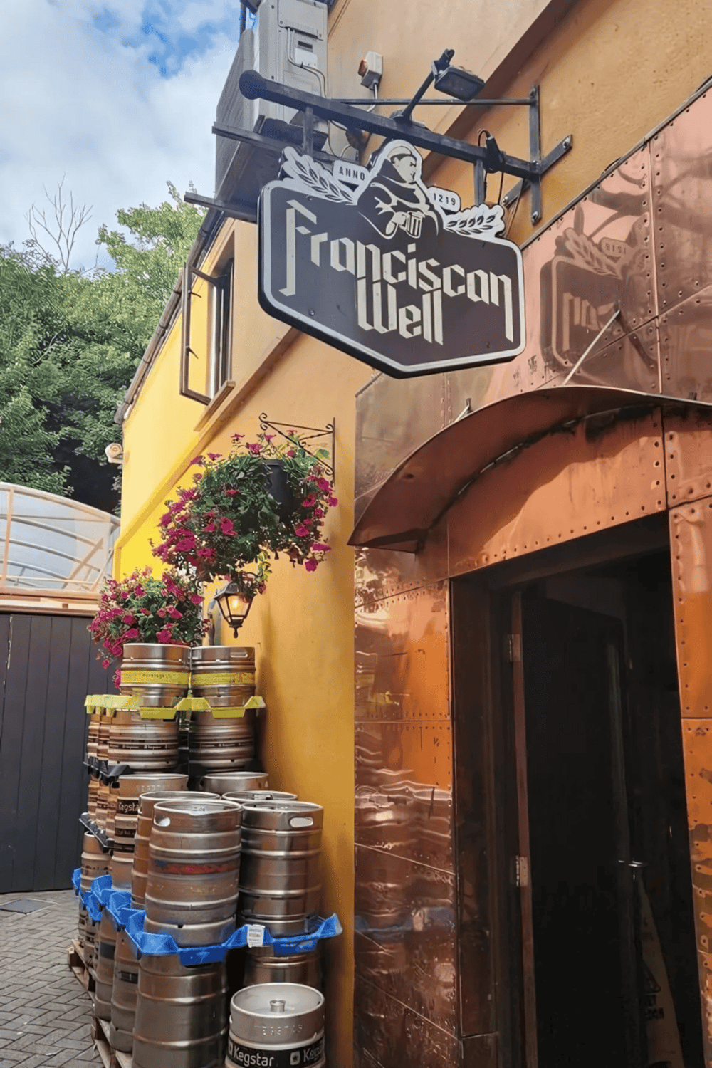 1. Sign for San Francisco Beer Hall with brewery logo and outdoor decor.