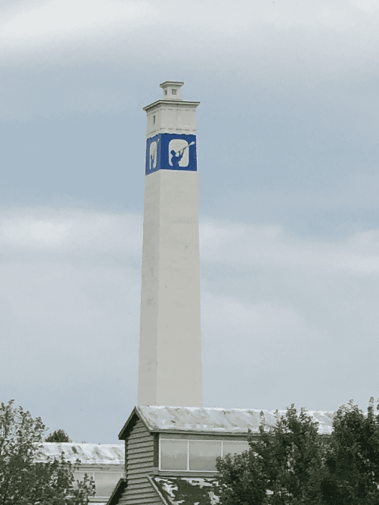 Spartanburg Water Tower with Quest for Directions logo in blue and white.