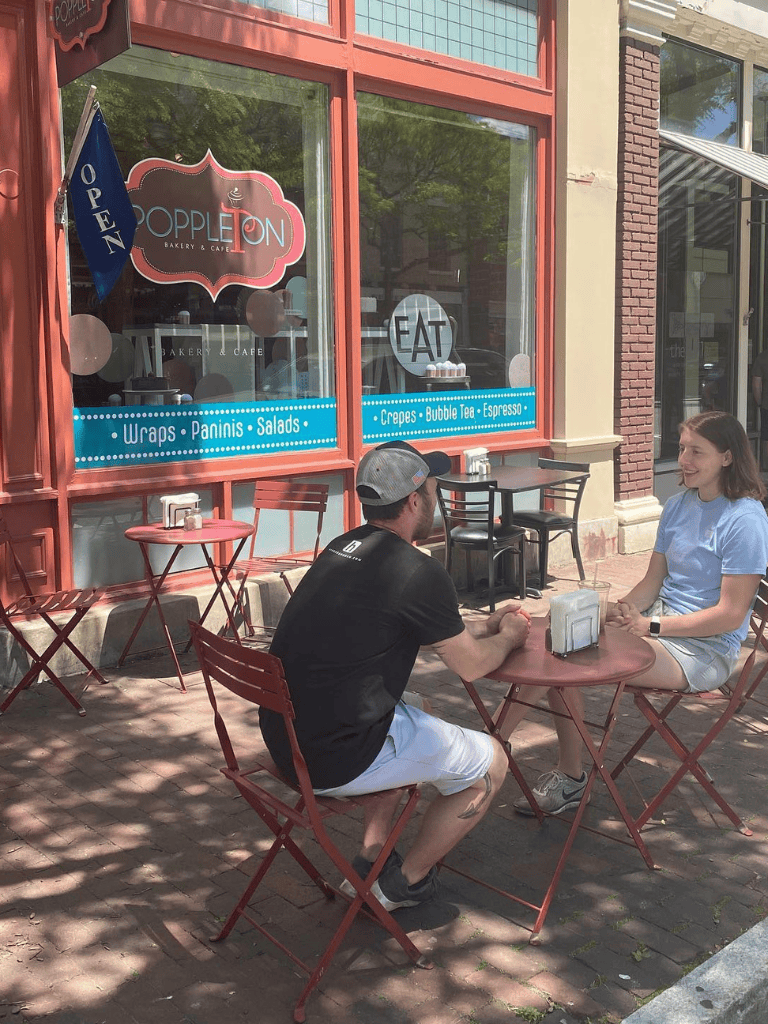 Casual outdoor dining at QuestForDirections bakery, cafe, featuring wraps, salads, and crepes.