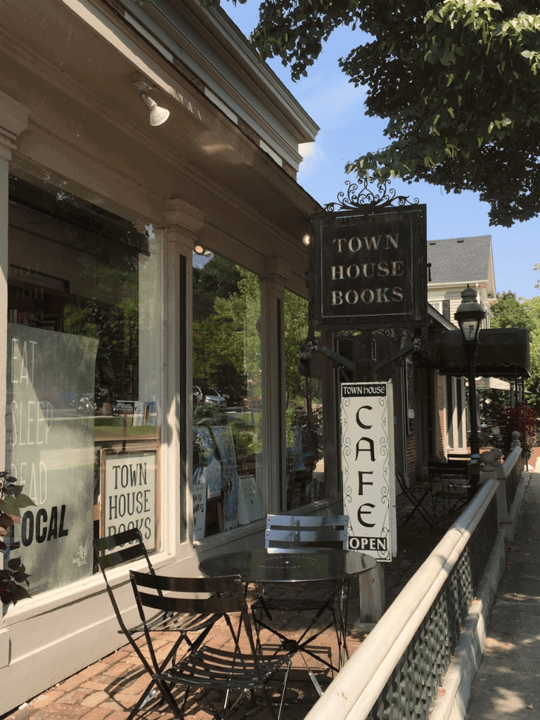 Cozy downtown bookstore and cafe with outdoor seating, vintage charm, and local community atmosphere.