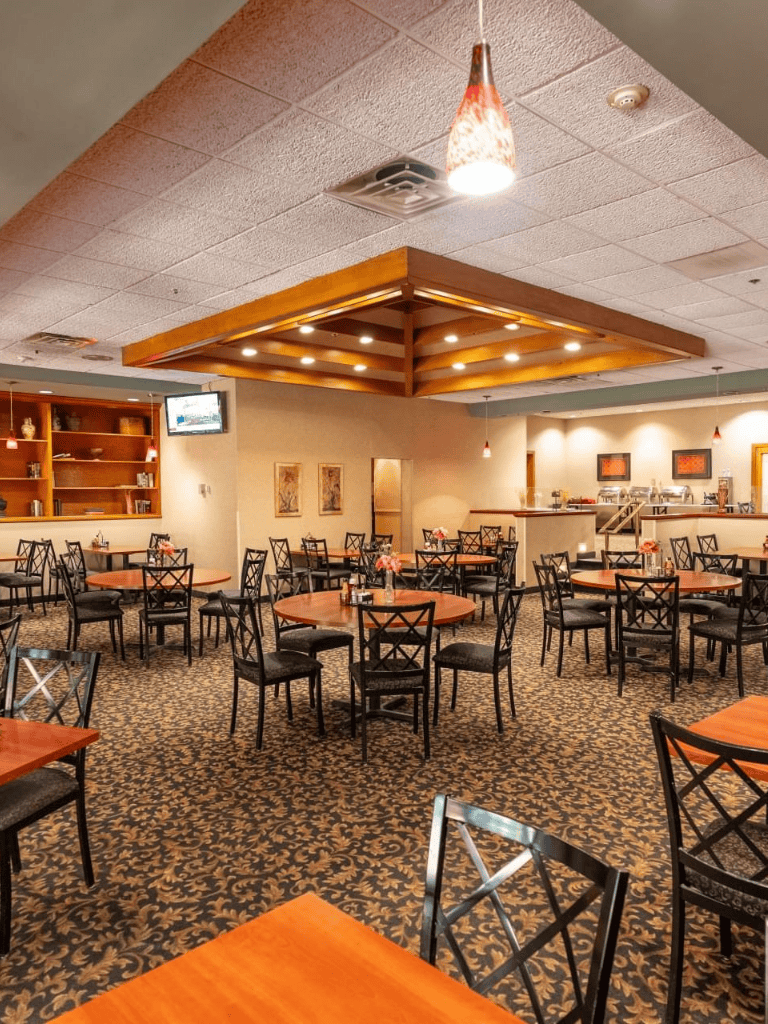 Comfortable restaurant dining area with warm lighting and elegant décor.