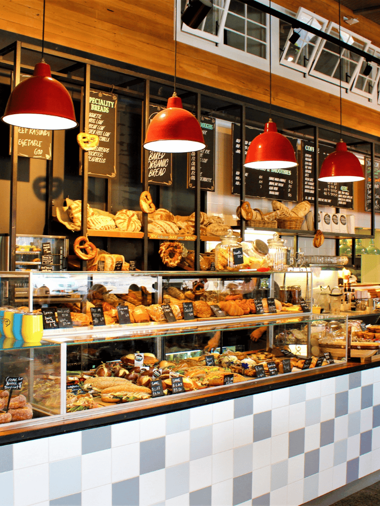 Fresh bakery display at Quest for Directions coffee shop, showcasing artisan breads and pastries.