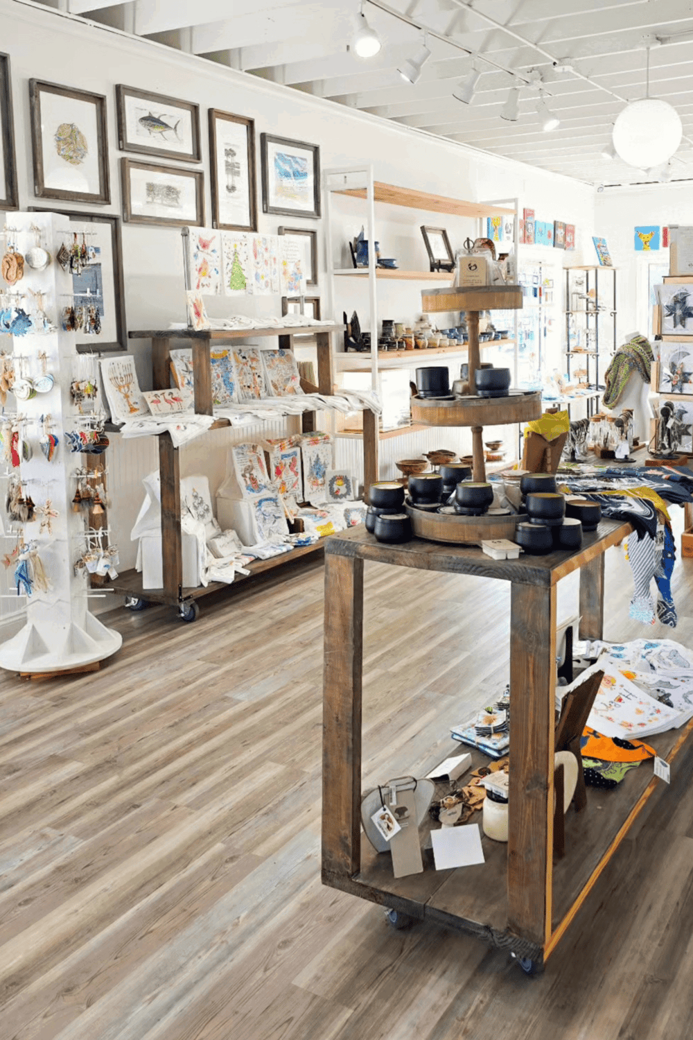 Colorful handmade arts and crafts shop with artwork, pottery, and jewelry displays for unique gifts.