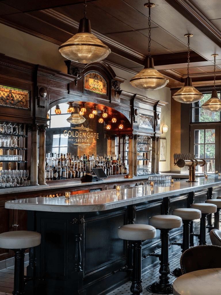 Luxurious vintage-style bar inside Golden Gate Saloon with classic wood decor and cozy ambiance.