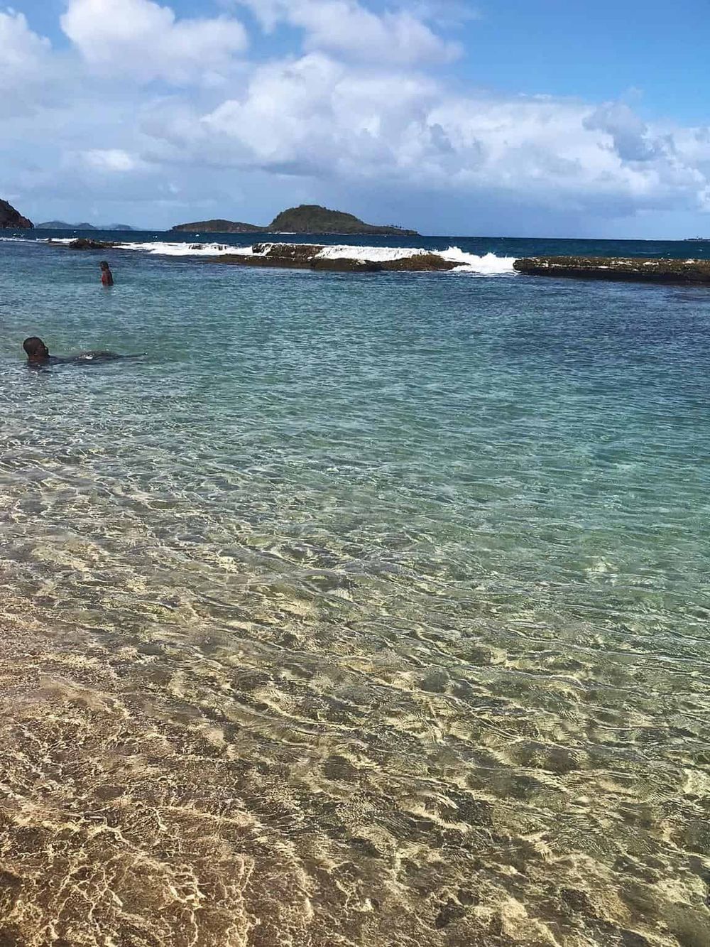 Pristine tropical beach with clear waters, relaxing atmosphere, and scenic island views for ultimate vacation enjoyment.