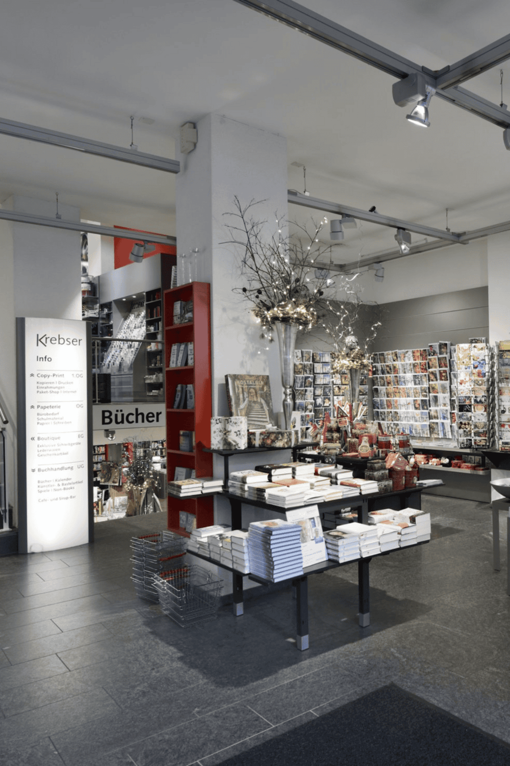 High-quality bookstore interior with books, greeting cards, and Christmas decorations for a welcoming shopping experience.