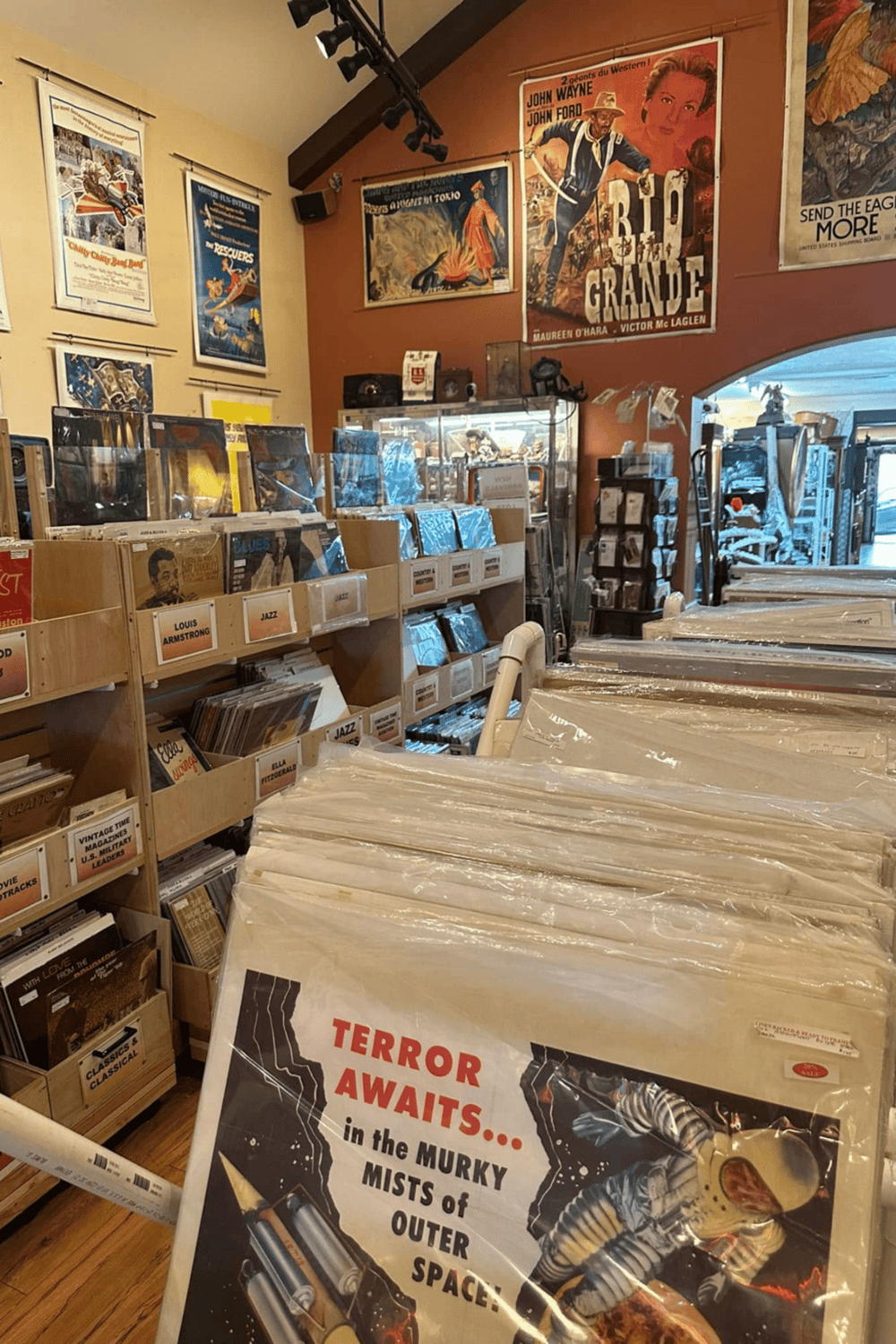 Vintage vinyl records and movie posters at Quest For Directions, a top destination for collectors and music enthusiasts.